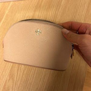 Blush colored Tory Burch makeup pouch